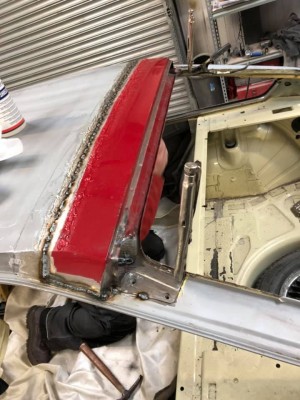 Full-width additional bracing is welded into position from inside the car to make the roof repair better and stronger than standard.