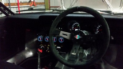 All lit up and operational, love that suede and the LCD display is very cool in an older car. Also most people don't know its aftermarket which is good. OEM look is always a good thing