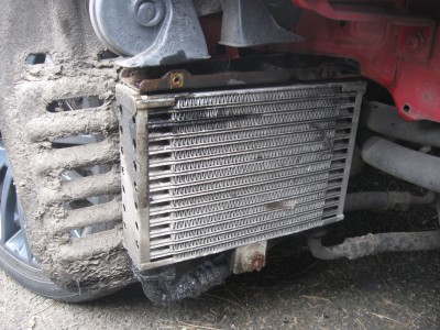 the old leaking oil cooler